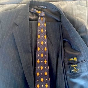 Clothier mens suit charcoal gray with light pinstripes and matching tie